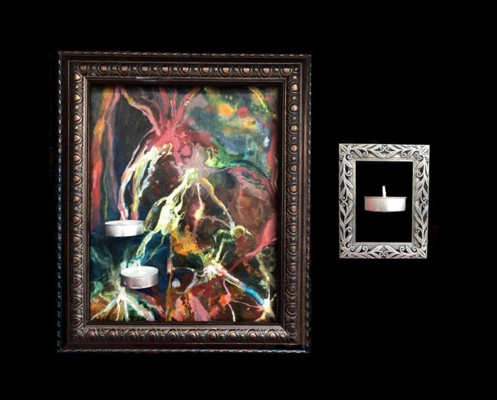 Two framed candle artworks